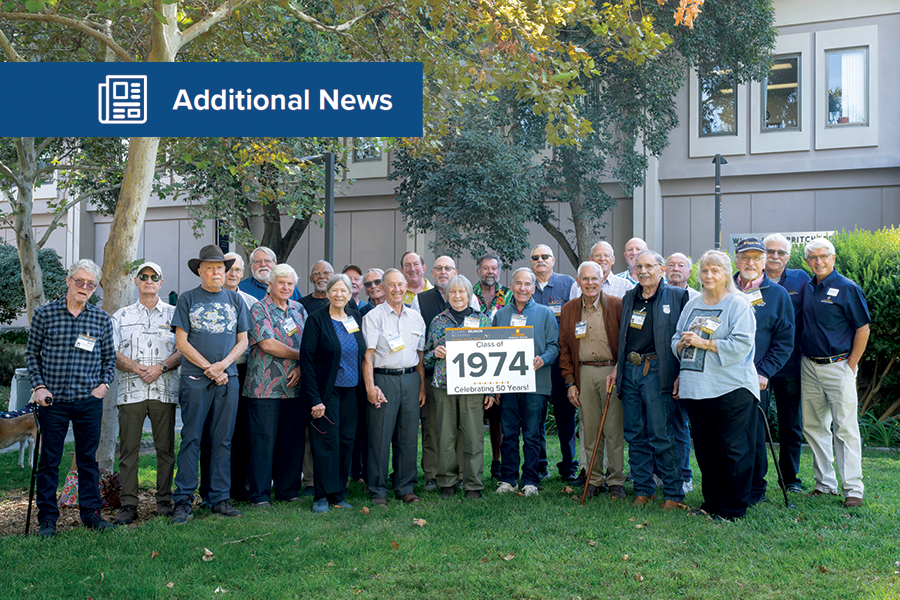 Class of 1974 gathered in front of the Veterinary Medical Teaching Hospital Small Animal Clinic with Dean Stetter.