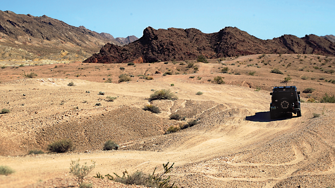 Jeep driving in desert.