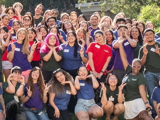 A portion of the class of 2028 group photo outside.